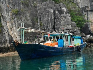 Fototapeta na wymiar Vietnam, Quang Ninh Area, Halong Bay or Ha Long Bay Unesco World Heritage Site, Fishing Boa