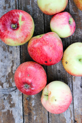 Ripe, bright apples on the table in the garden