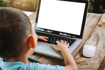 children working laptop and on the white table at home office. in morning light 