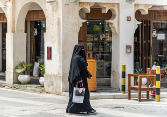 Local people of Doha going about their daily lives.