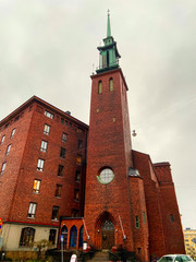 Helsinki, Finland - December 30, 2019. Finnish Neo-gothic church Kristuskyrkan (Church of Christ), part of the Swedish Methodist Church of Finland. 59-meter bell tower with spire