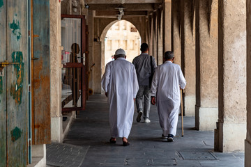 Naklejka premium Local people of Doha going about their daily lives.