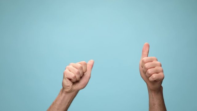 two fists waving around, giving a ok sign, pointing at camera and celebrating succes on blue background