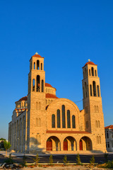 Fototapeta na wymiar Agioi Anargyroi Orthodox Cathedral in Paphos, Cyprus. View of the church in the sun at sunset.
