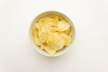 plate with chips on a white background top view. junk food