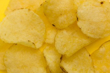 some potato chips on a yellow background