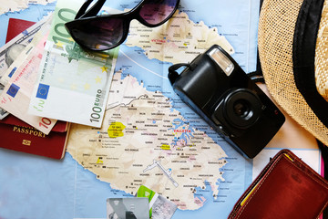 Fototapeta na wymiar Travel accessories, map on a wooden table, journey