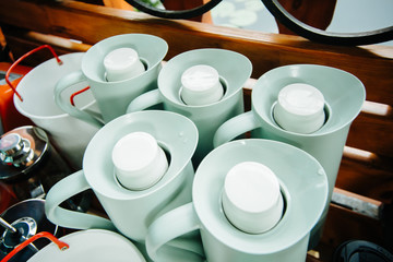 several thermos jugs with lids