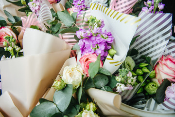 several small bouquets of roses and gillyflower