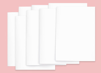 White paper mock-ups isolated on pink background, Blank portrait paper A4. brochure newspaper magazine, can use poster banners products business texture for your. 