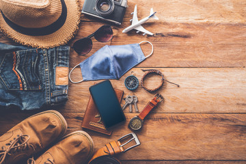 Protecting COVID-19 while Traveling. Travel accessories costumes. Passports, luggage, The cost of...