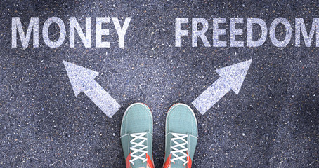 Money and freedom as different choices in life - pictured as words Money, freedom on a road to symbolize making decision and picking either Money or freedom as an option, 3d illustration © GoodIdeas