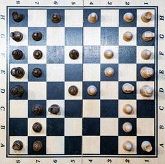 black and white chessboard with chessmen (game)