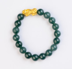 Green jade bracelet on white background