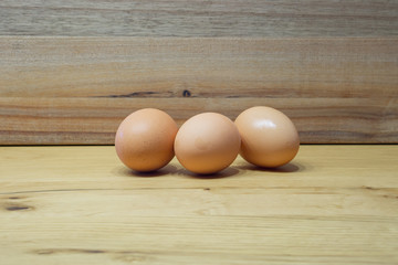 brown eggs on wooden table