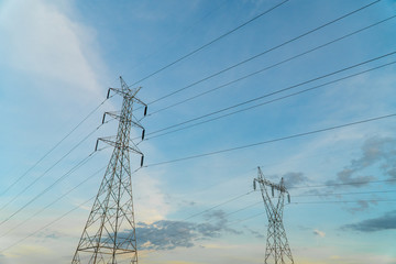 Electric high voltage tower with blue sky and cloud. Electric pole with copy space.