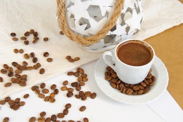 cup of coffee with beans, decorative corner scene. Flat lay, top view