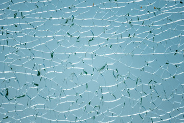 Fototapeta premium Cracks in the glass. Broken glass, texture background design object