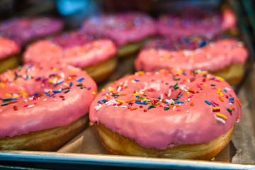 Pink donut with sprinkles