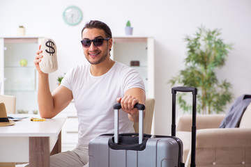 Young man preparing for departure at home