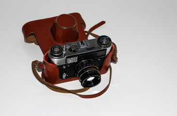 Soviet camera on a light background in a case.