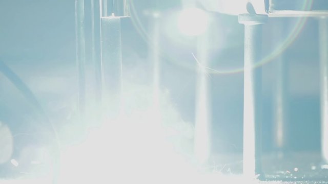 Welder working on an iron plate.
