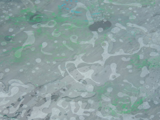 wet glass with the remnants of paint on the wooden table.an arbitrary drawing of water on a glass surface.