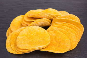 heap of potato crisps snack with paprika