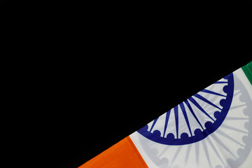 Top view of National Flag of India on black background.