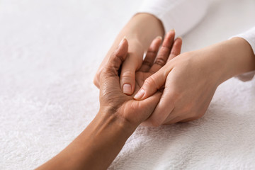 Acupuncture hand massage for black woman at spa - obrazy, fototapety, plakaty