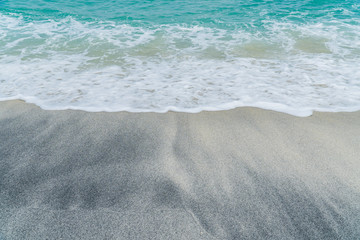 Fototapeta na wymiar waves on the sand beach