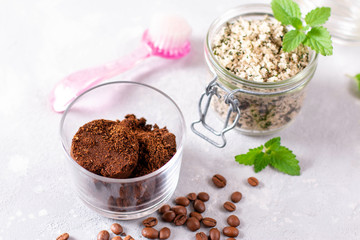 Body scrub of ground coffee and peppermint sugar in glass jar, homemade cosmetic for peeling