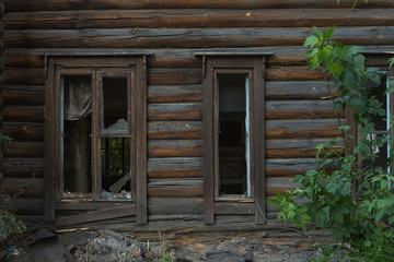 Fototapeta na wymiar window of an old wooden house dust on the glass