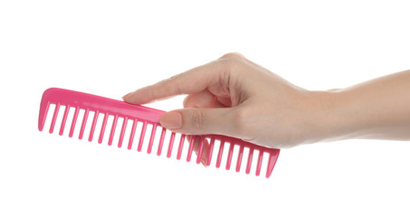 Naklejka premium Woman holding hair comb on white background, closeup