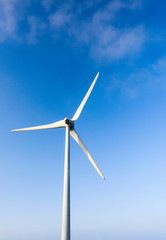 Fototapeta premium Close-up of windmills group with blue sky, on the west coast of Taiwan.