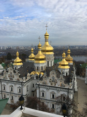 Fototapeta na wymiar Golden cupolas with crosses of St. Michael's Cathedralin Kiev , Ukraine