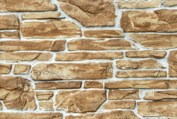 Decorative light brown stone masonry background