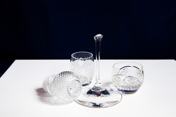 still life with broken glass goblet on dark background