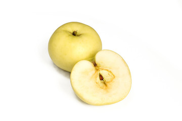 One and a half apple isolated on white background. Yellow fruit sliced