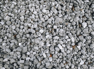 Slag in the form of gray stones, top view. Waste rock during iron ore mining.