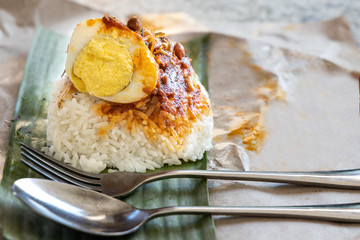 Simple authentic nasi lemak bungkus wrapped with banana leaf