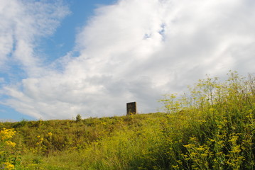 rural landscape with mystical slab and clouds