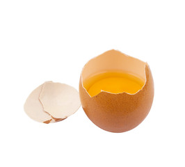 Egg shell with yolk isolated on white background 