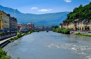 Fototapeta na wymiar Picturesque view on Grenoble city and bridges on Isere river
