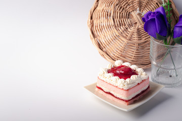 Strawberry layer cake in ceramic plate on white background.copy space