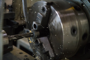 Obraz na płótnie Canvas Cutting tool at metal working on lather machine