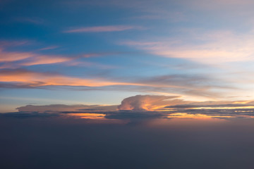 Fototapeta na wymiar Sunset sky during twilight from airplane window