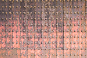 Old grunge metal wall in an old temple