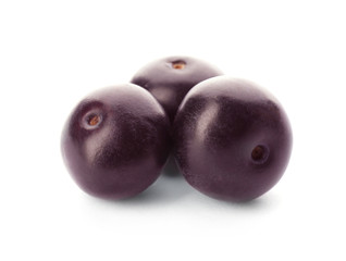 Fresh ripe acai berries isolated on white