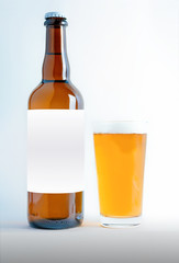 A Big Beer Bottle Mock-Up with glass of session pale ale and foam. Blank Label
